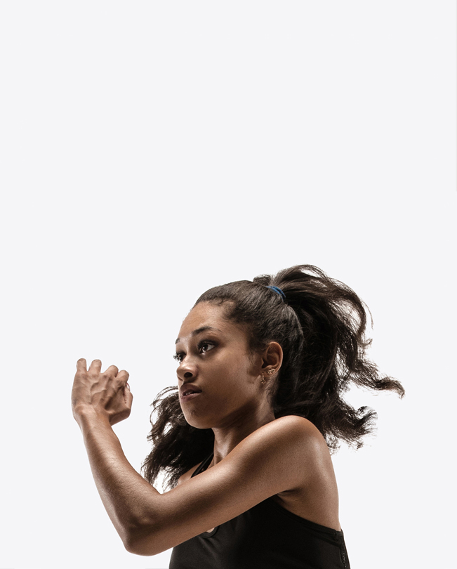 Eine Apple Mitarbeiterin mit Pferdeschwanz während des Trainings.  