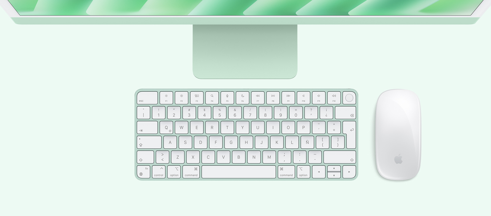 Vista panorámica de un iMac verde con mouse y teclado a juego