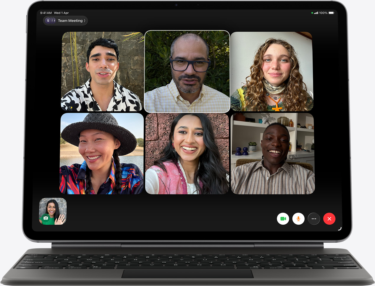 iPad Air, front exterior, Magic Keyboard, black colour, FaceTime call on the screen, multiple participants visible