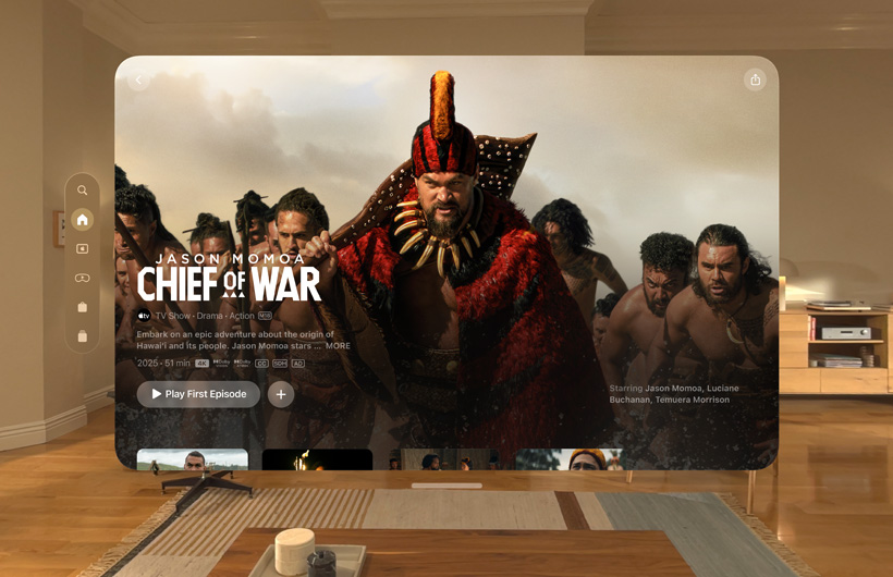 The Apple TV+ experience of Apple Vision Pro is displayed in a living room, with a still image from the Apple TV+ series Chief of War