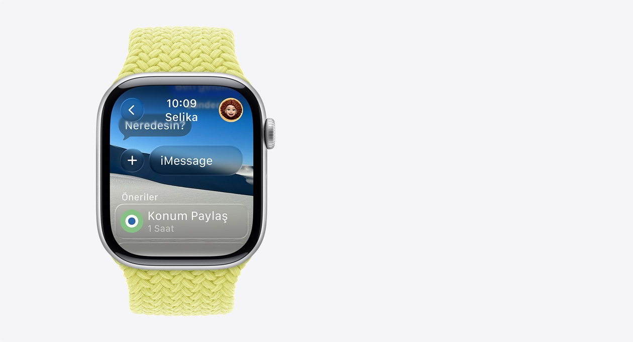 Mor Menekşe rengi kayışa sahip Gümüş rengi Apple Watch'un ekranında yarı saydam “Neredesin?” mesajı ve altında Önerilenler kısmında “1 saat boyunca Konumu Paylaş” yazan akıllı bir eylem yer alıyor