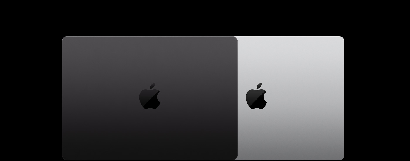 Vista desde arriba de dos laptops Mac cerradas, ubicadas una sobre otra.