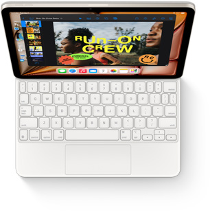 Изглед отгоре на iPad Air с бяла клавиатура Magic Keyboard.